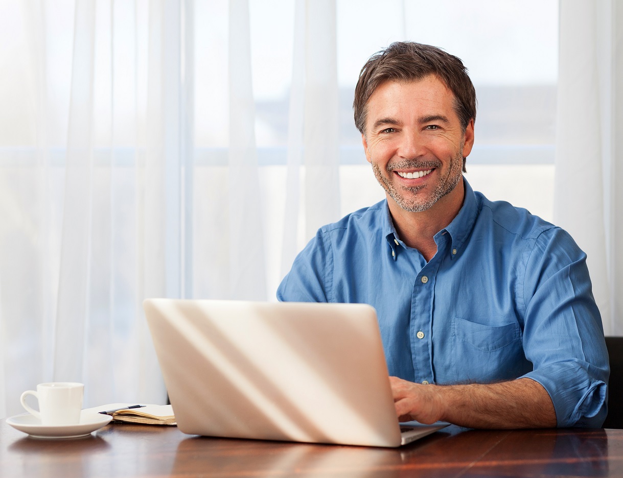 A,Portrait,Of,A,Smiling,Middle-aged,Bearded,Man,On,A