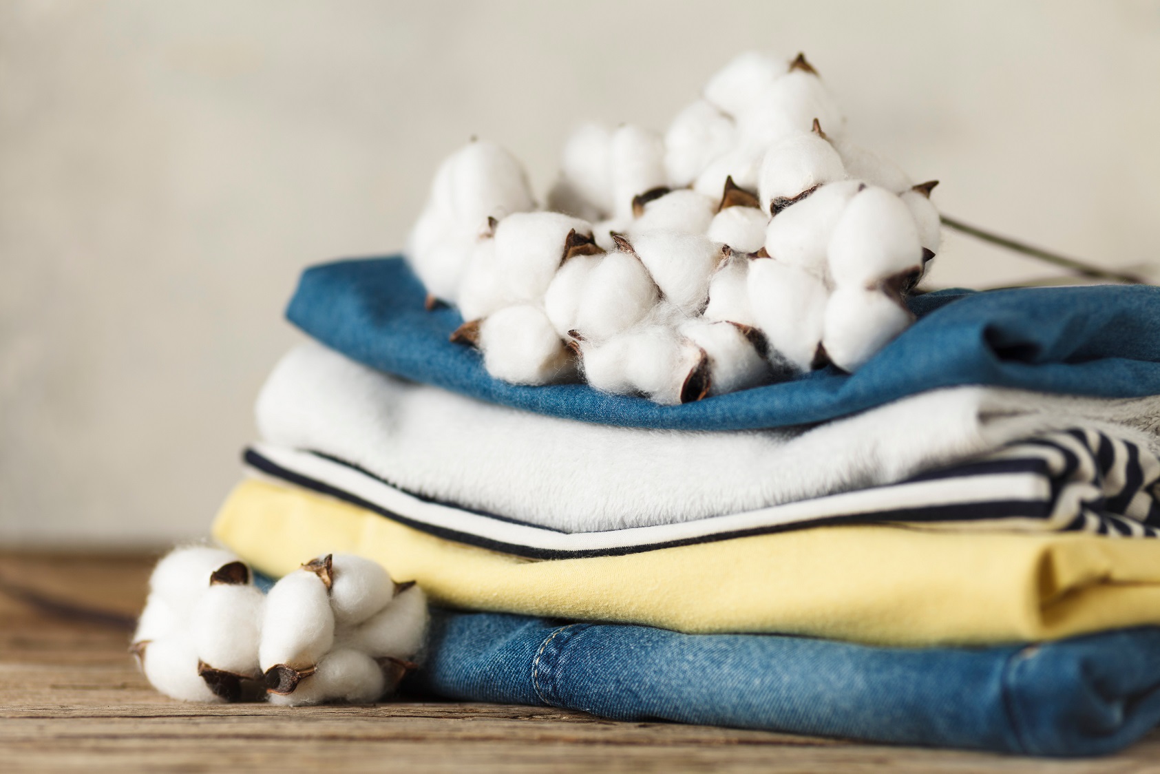 a stack of clothing with cotton on top