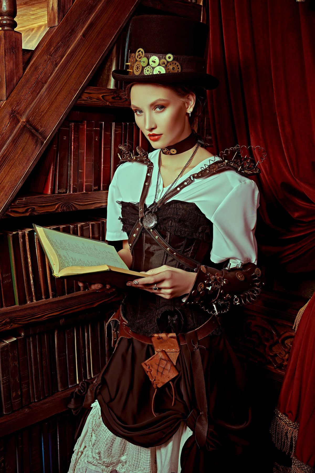 portrait of a steam punk model reading a book