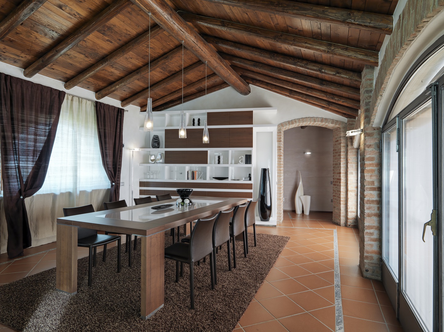 a dining room and small kitchen farmhouse style with terracotta tiles